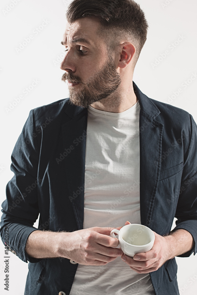 Portrait of stylish handsome young man with cup of coffee Portrait of stylish handsome young man with cup of coffee