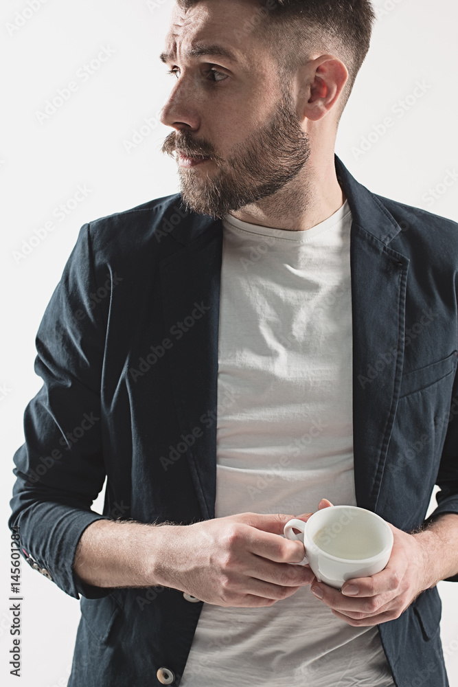 Portrait of stylish handsome young man with cup of coffee Portrait of stylish handsome young man with cup of coffee
