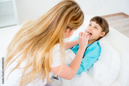 Doctor visiting sick girl