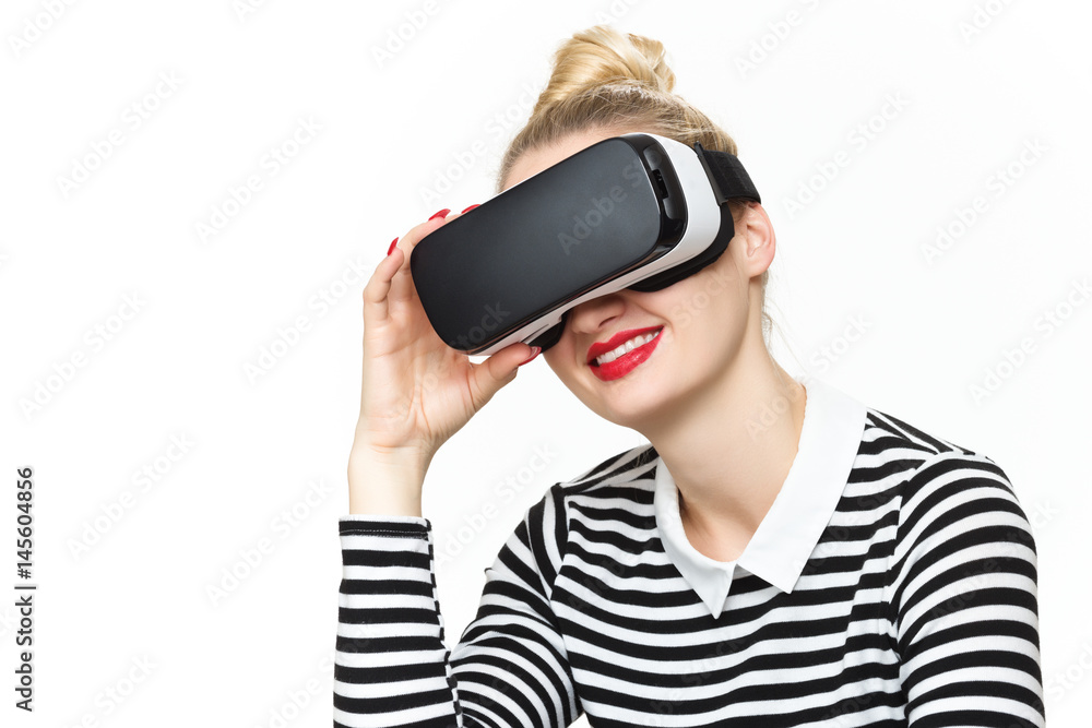 Attractive woman wearing virtual reality glasses. VR headset. Virtual reality concept on white background. Attractive woman wearing virtual reality glasses. VR headset. Virtual reality concept on white background.