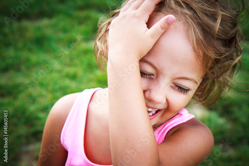 Beautiful little girl laughs