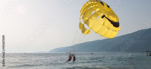 Obraz na plátně Parasailing in a blue sky