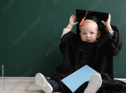 Cute little boy with book, ...
