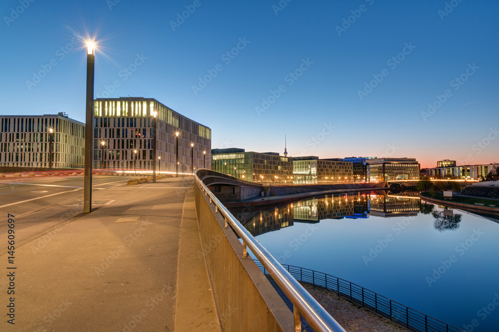 Bridge and office buildings at the river Spree in Berlin in the early morning