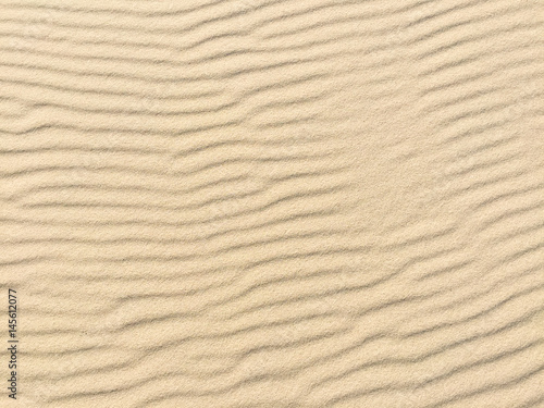 Beach sand - beach sand with waves of the blow of the wind