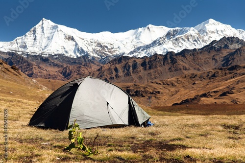 View of tent, Putha Churen Himal and Dhaulagiri Himal