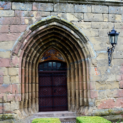 Gate of the fortified saxon medieval church Harman, Transylvania, Romania photo