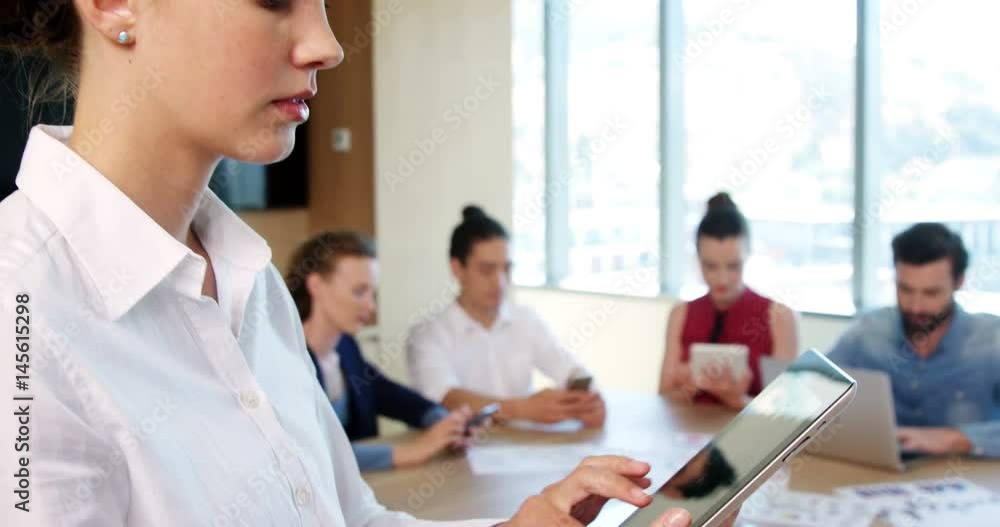 Female business executive using digital tablet