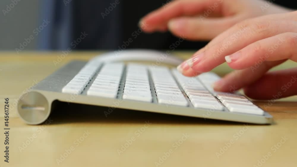 Fingerboard. Close Female arms typing on the computer keyboard Fingerboard. Close Female arms typing on the computer keyboard