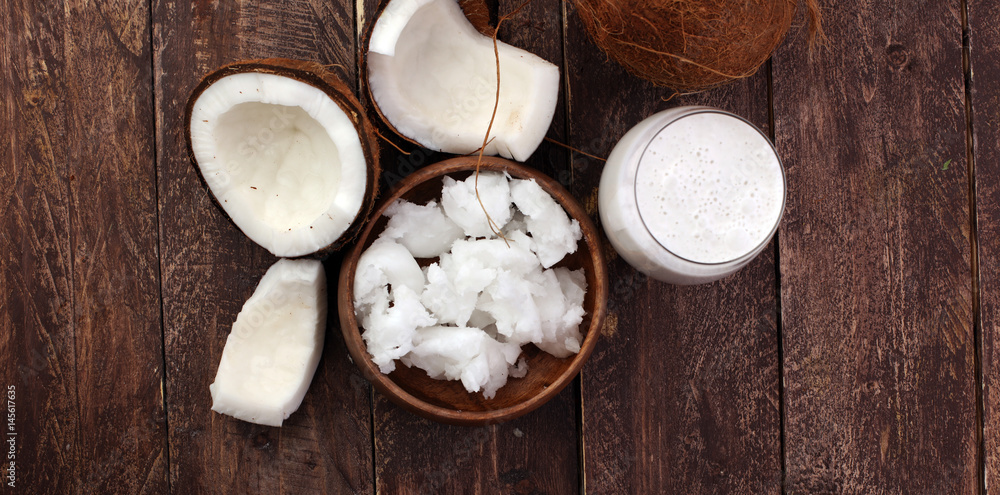 Coconut vegan milk non dairy in bottle and coconut oil Coconut vegan milk non dairy in bottle and coconut oil