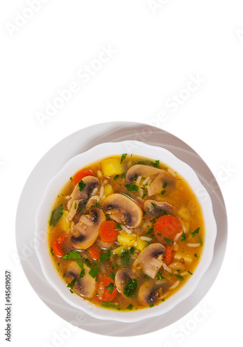 mushroom soup with rice and vegetables. top view. isolated on white