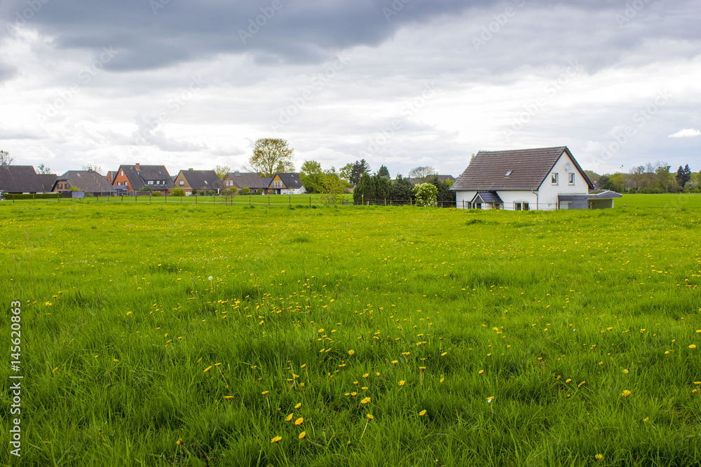 Spring meadows around a rural house, Lower Rhine, Germany