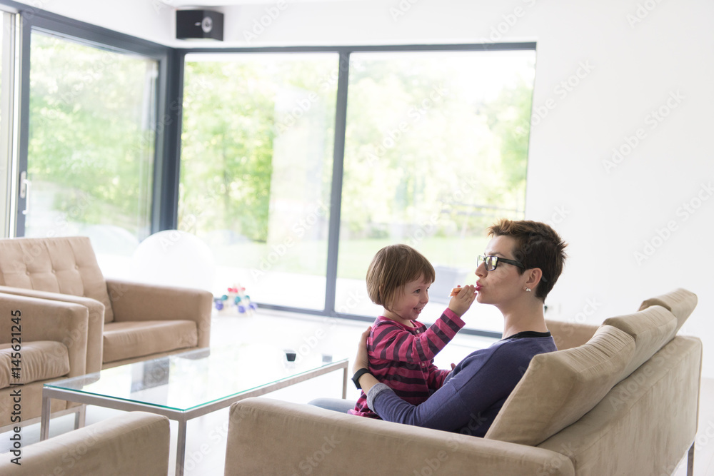 mother and cute little girl enjoying their free time mother and cute little girl enjoying their free time
