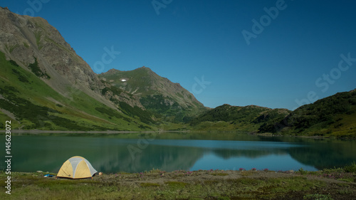 Camping outside a lacier lake in Alaska photo