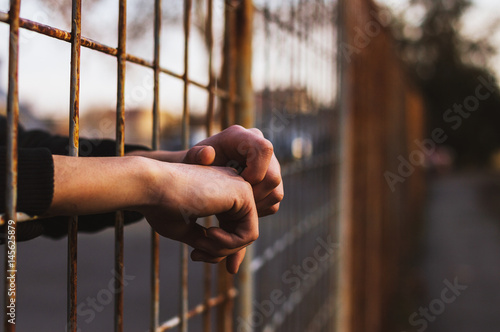 Hands in jail photo