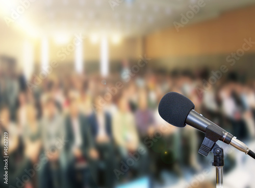 Microphone on stage against a background of auditorium