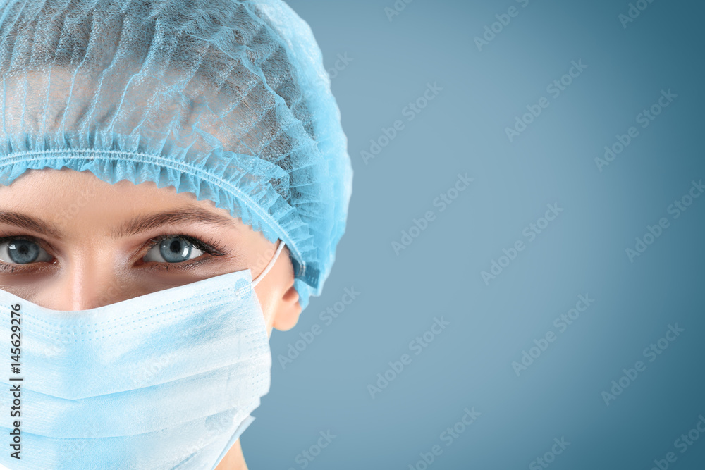 Female surgeon on blue background Female surgeon on blue background