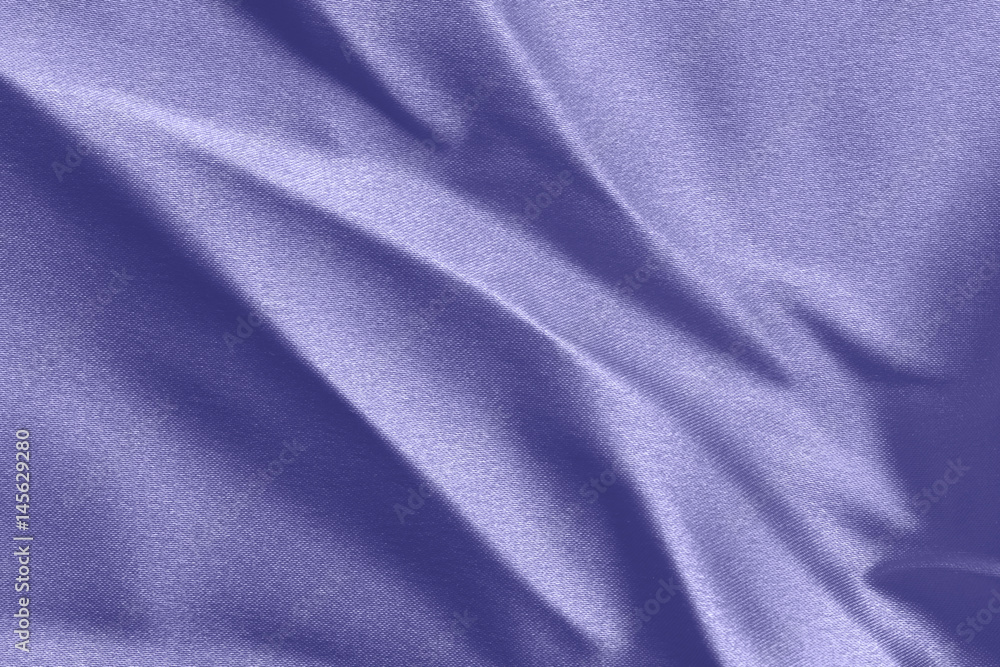 Texture of a crumpled blue cloth with large folds Texture of a crumpled blue cloth with large folds