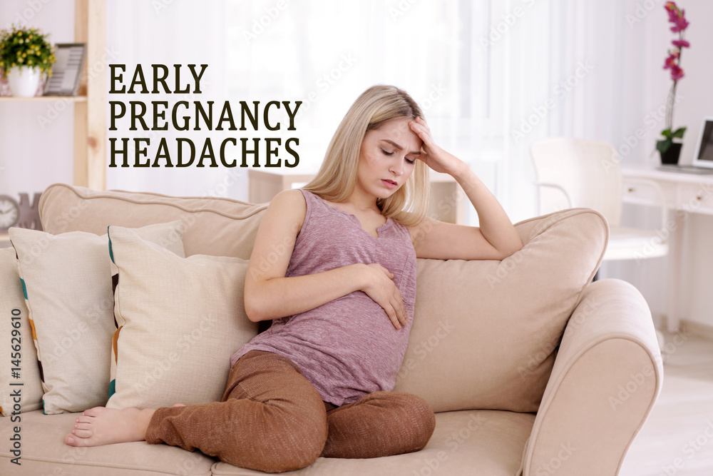 Young pregnant woman suffering from headache at home Young pregnant woman suffering from headache at home