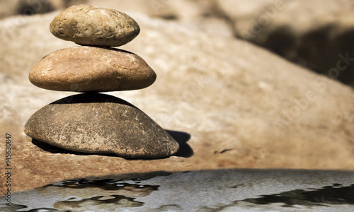 Balancing stones with artificial water reflection