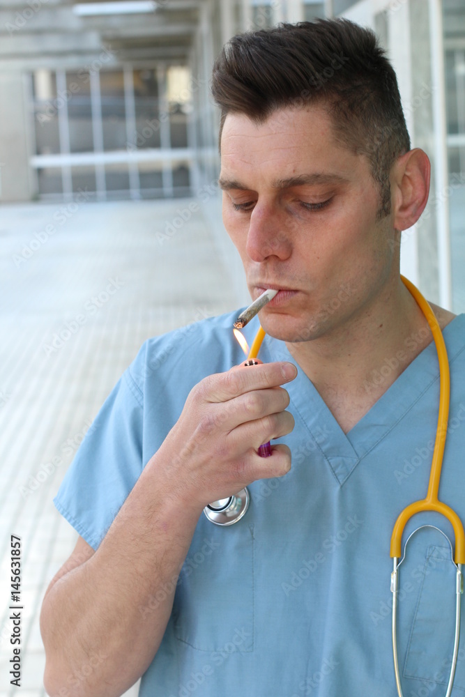 cigarette doctor Careless doctor smoking a cigarette - Stock image Stock Photo