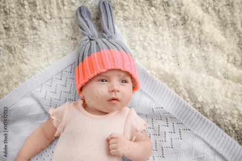 Cute little baby lying on p...