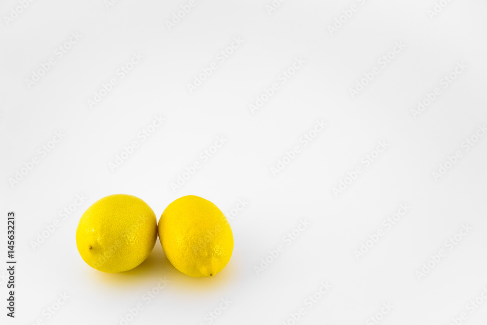 Two whole lemons isolated on white background Two whole lemons isolated on white background
