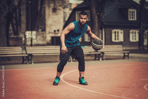 African-american streetball player practicing outdoors © Nejron Photo
