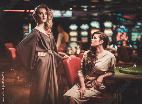 Beautiful women in a luxury casino interior
