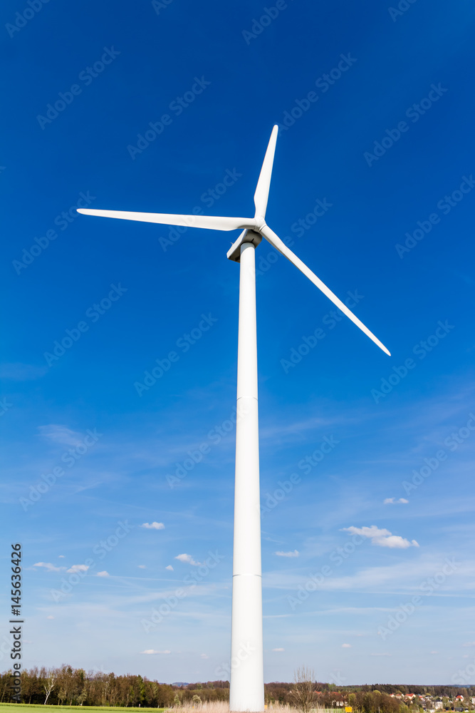 Wind turbine with blue sky - renewable energy