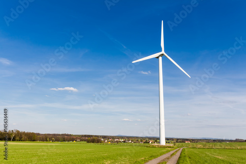 Wind turbine with blue sky - renewable energy
