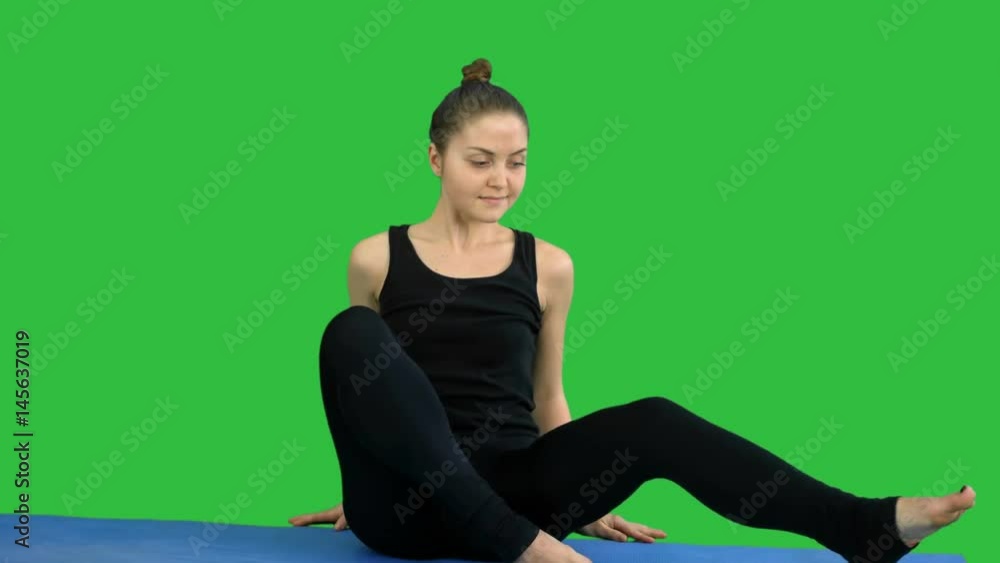 Fitness woman stretching her body doing pilates on a Green Screen, Chroma Key Fitness woman stretching her body doing pilates on a Green Screen, Chroma Key