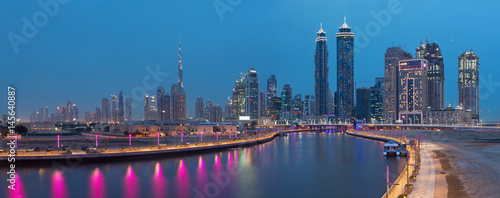 DUBAI  UAE - MARCH 27  2017  The evening skyline with the bridge over the new Canal and Downtown.