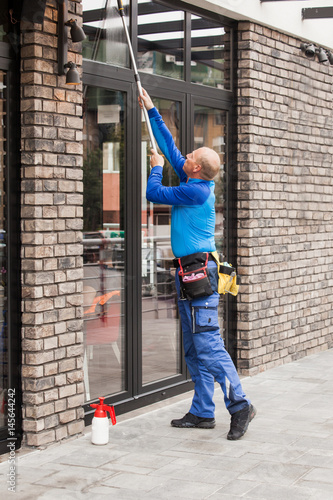 window washer working  at building outdoor