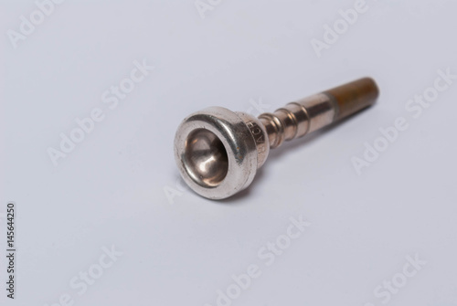 trumpet mouthpiece on white background