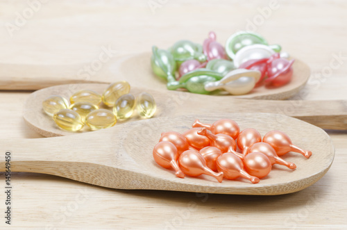Multi-colored vitamins on white background