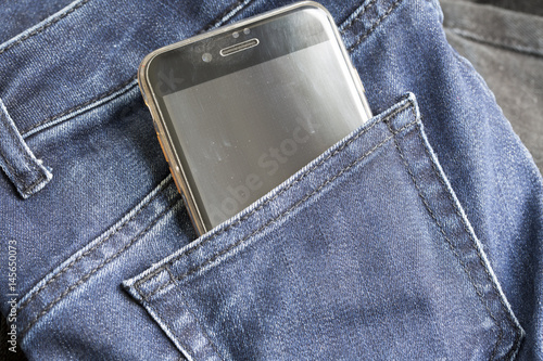 Mobile Phone in Jeans photo