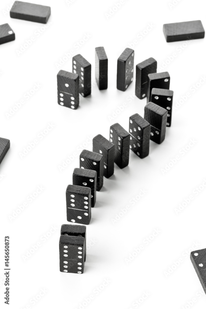 Risk, challenge or uncertainty concept - domino game stones forming question mark Risk, challenge or uncertainty concept - domino game stones forming question mark