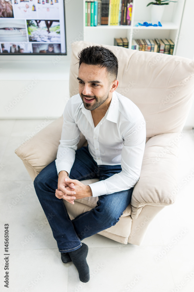 Young confident man at home