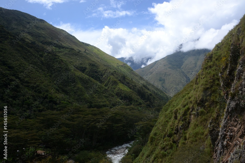 Landscape view of a deep valley and gushing river in the remote Peruvian Andes 