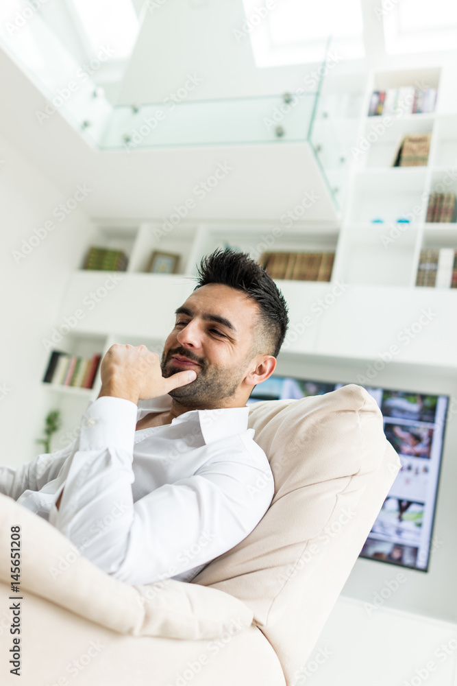 Young confident man at home