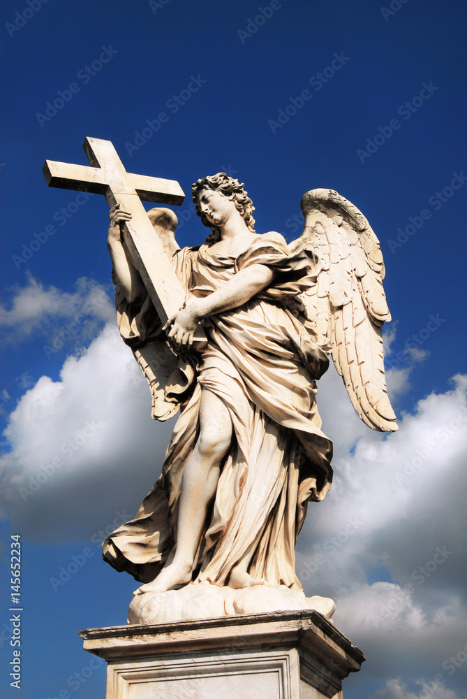 Angel statue with Holy Cross and clouds in Rome