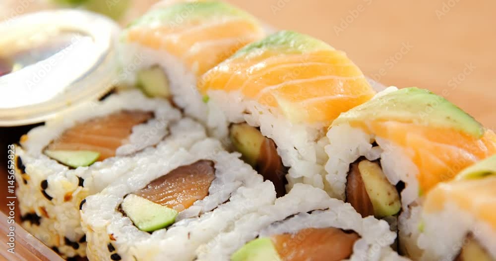 Sushi rolls with salmon in plastic container Sushi rolls with salmon in plastic container