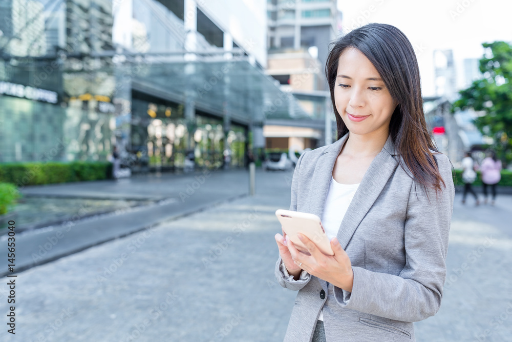 Professional business woman using mobile phone Professional business woman using mobile phone