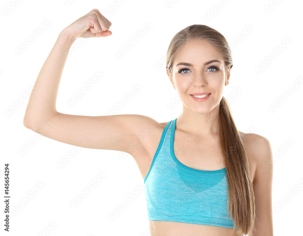 Young beautiful woman showing biceps on white background Young beautiful woman showing biceps on white background