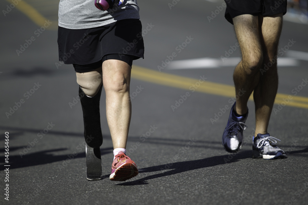 Disabled Marathon Runner running on the track.