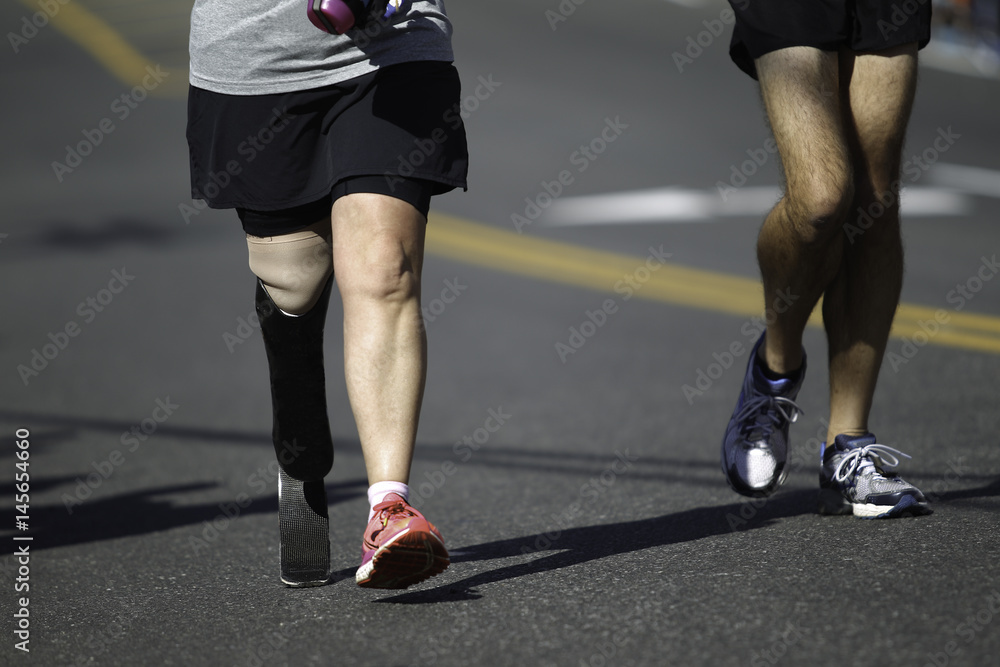 Disabled Marathon Runner running on the track. Disabled Marathon Runner running on the track.