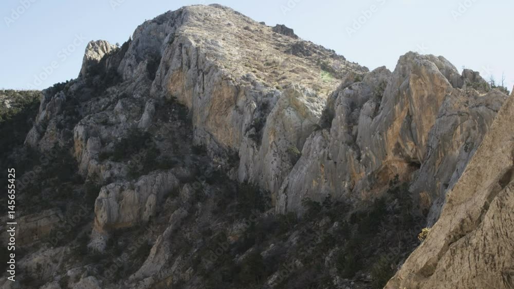 landscape of large mountain with girl rock climbing on wall landscape of large mountain with girl rock climbing on wall