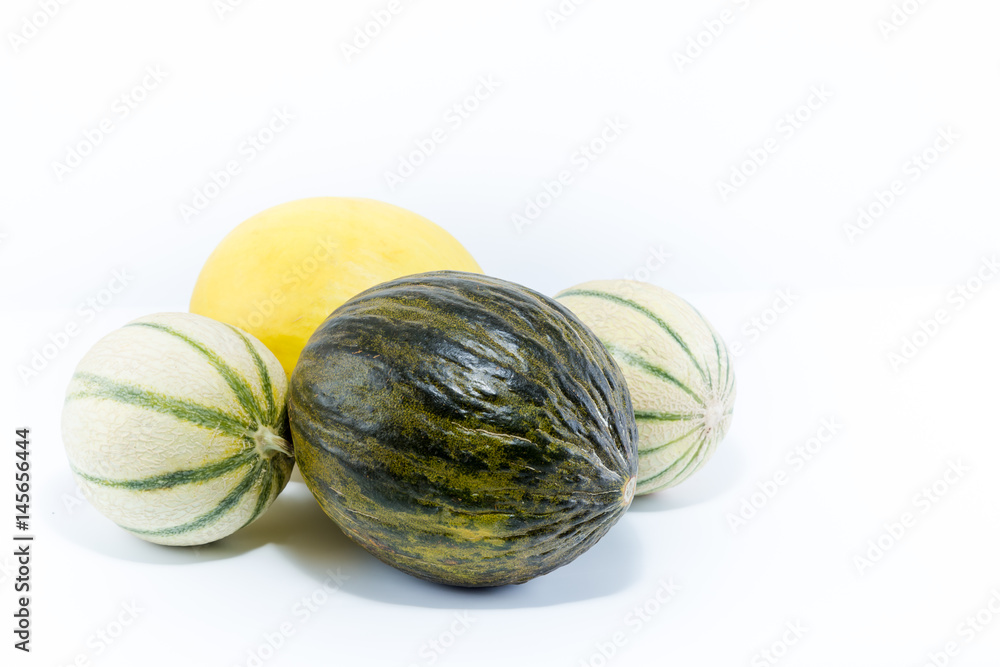 Three varieties if melon. Canary, Santa Claus and Charentais melons isolated on white background