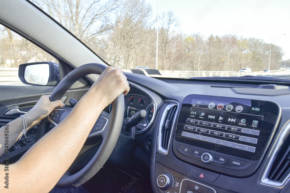 Man with hands on driving wheel Man with hands on driving wheel